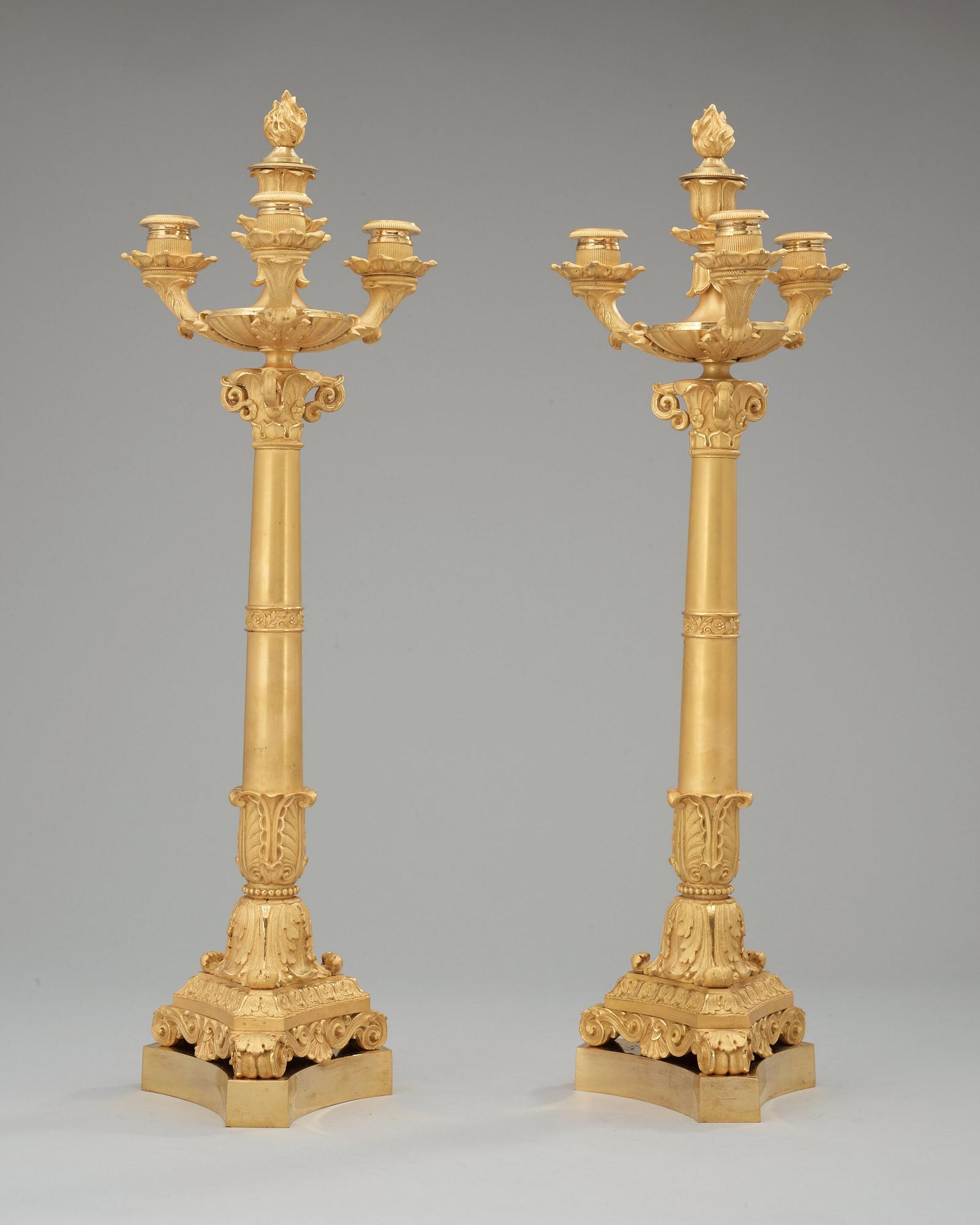 A pair of French Empire early 19th century four-light candelabra.