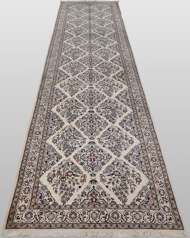 A Nain part silk carpet, 408 x 98 cm.