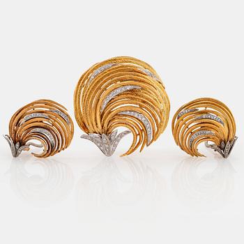 1048. An 18K gold and white gold brooch and a pair of earrings.