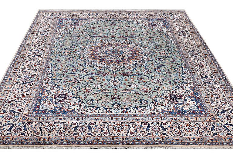 A carpet, Nain, part silk, 9 laa, circa 383 x 294 cm.