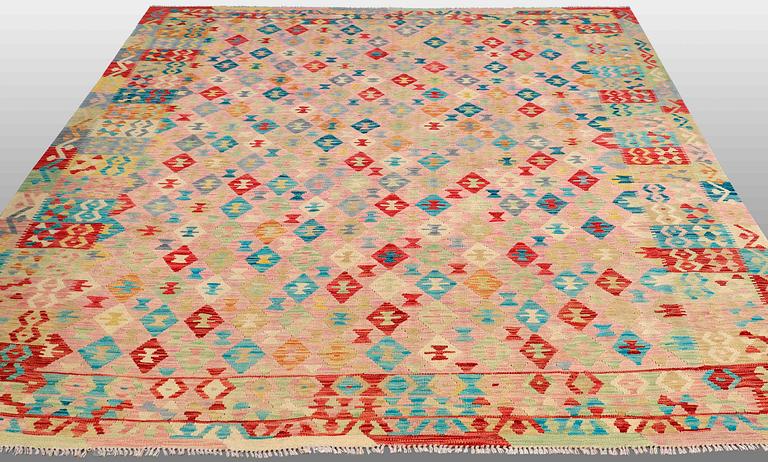 An oriental kilim, around 290 x 250 cm.