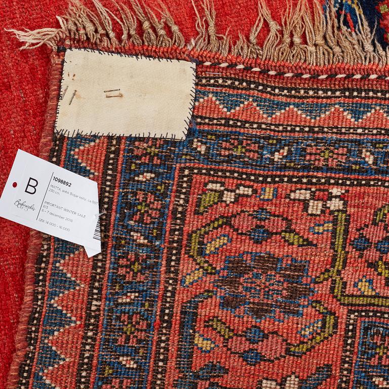 A CARPET, an antique Bidjar kelly, ca 587 x 230 cm.