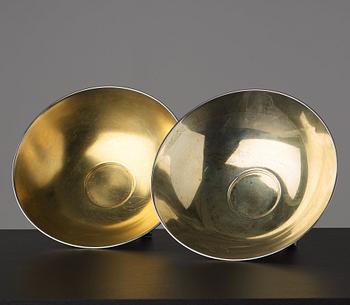 A pair of Swedish 20th century parcel-gilt silver bowls, maker's mark of CG Hallberg, Stockholm 1934 and 1935.