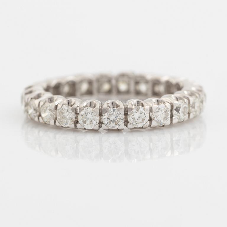 Brilliant cut diamond eternity ring.