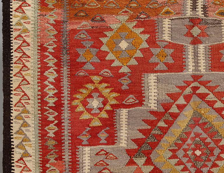 A Persian nomadic kilim, approximately 260 x 150 cm.