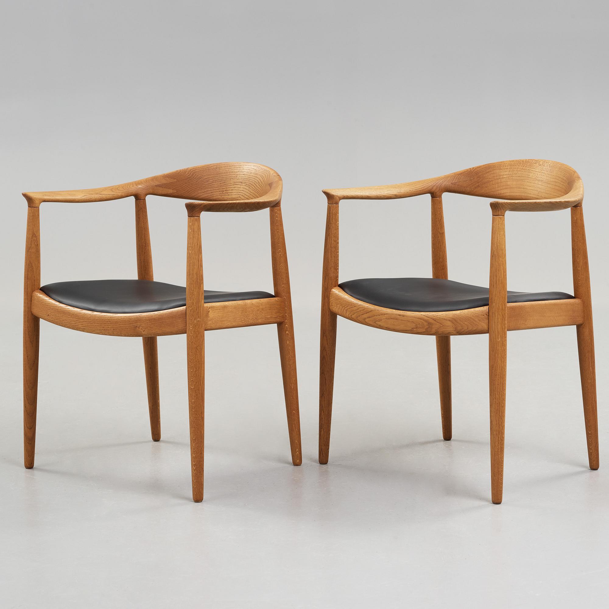 A pair of Hans J Wegner's oak 'The Chair' by Johannes Hansen