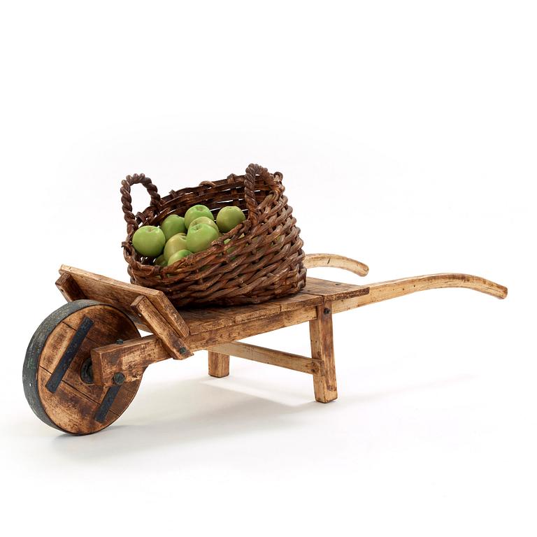 Ingrid Herrlin, a stoneware basket with 30 apples and a wheelbarrow, Sweden ca 1988.