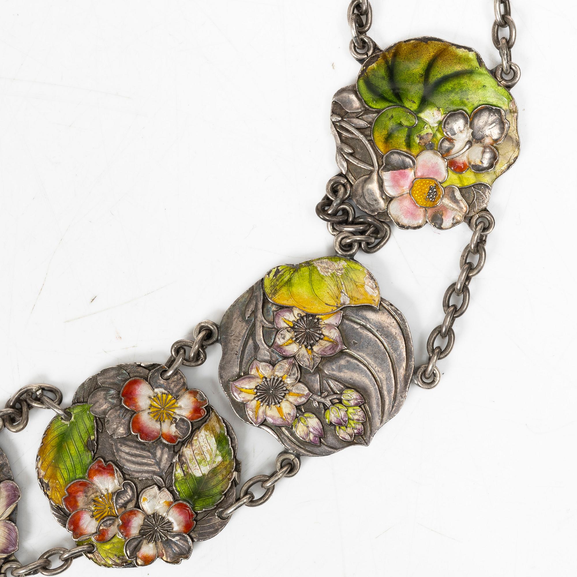 A Japanese Art Nouveau silver and enamel floral belt, by Sanju Saku, Meiji period (1868-1912).