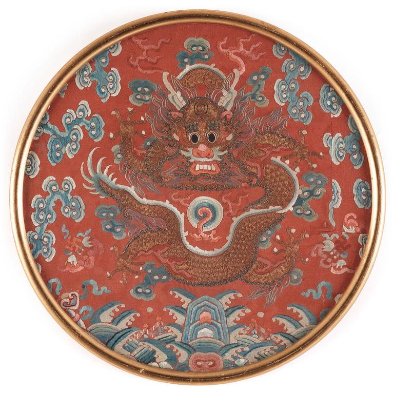 An embroidered dragon roundel from the surcoat of an Emperor or Imperial son, Qing dynasty, 19th century.