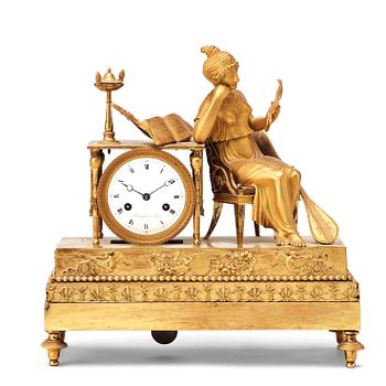 621. A French Empire early 19th century gilt bronze mantel clock.