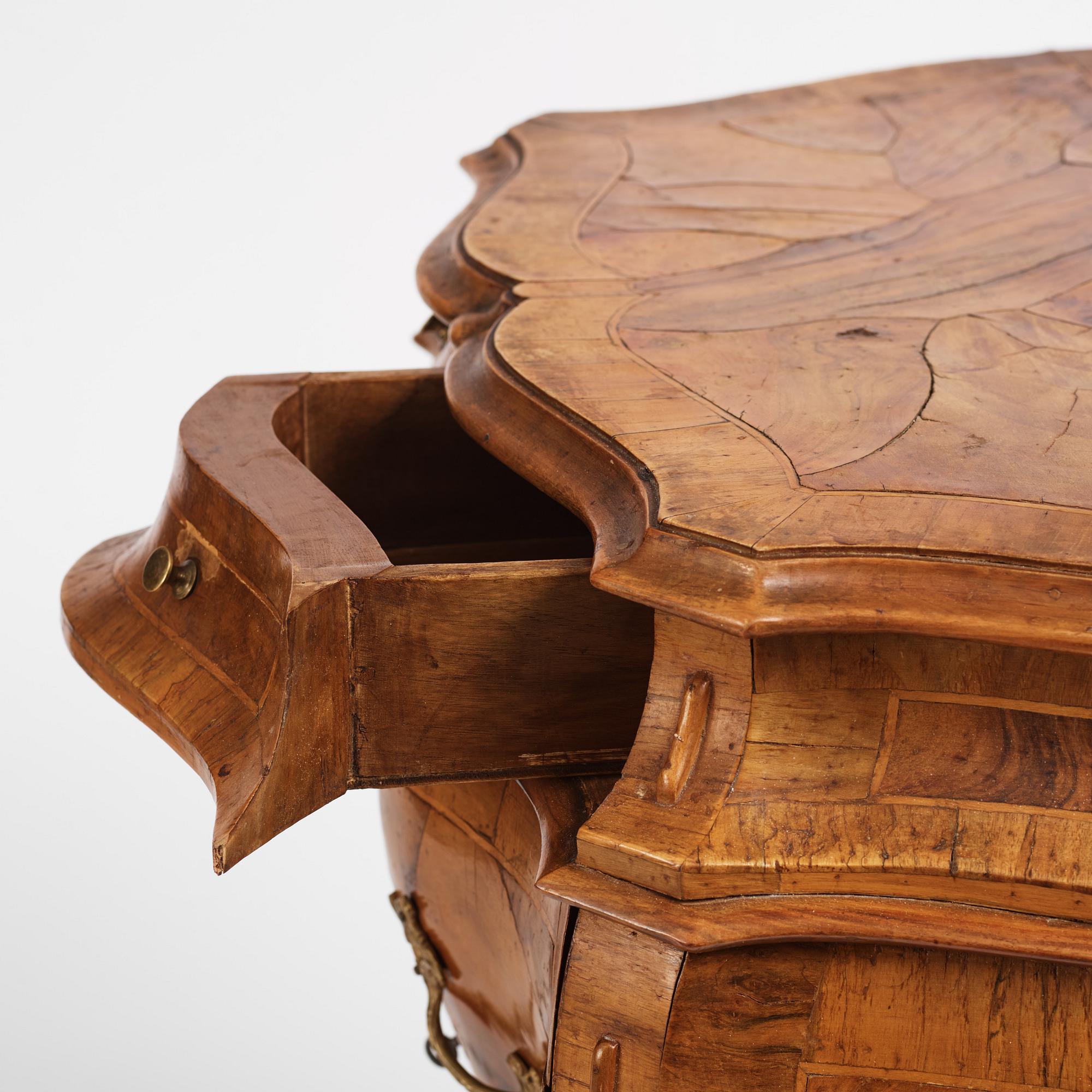 An Italian Louis XV-style bombé commode, 20th century.