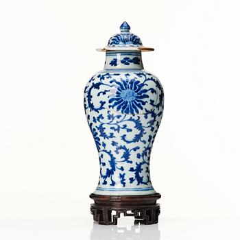 A Chinese blue and white lotus vase with cover, Qing dynasty, 18th Century.