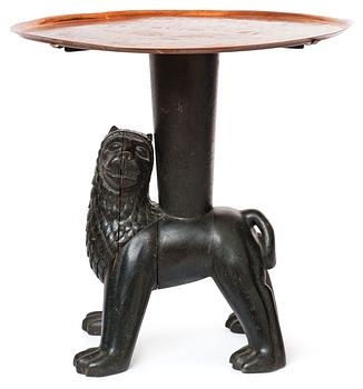 An Anna Petrus table, Sweden early 1920's. Sculptured oak with an engraved copper tray.