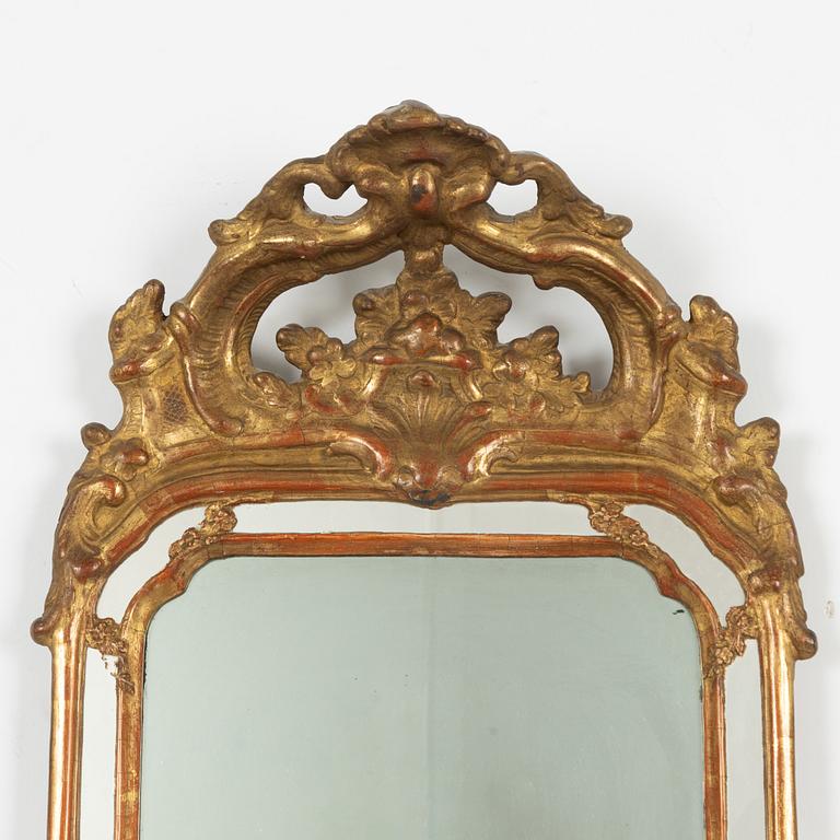 A pair of Swedish rococo two-light girandole mirrors, later part 18th century.