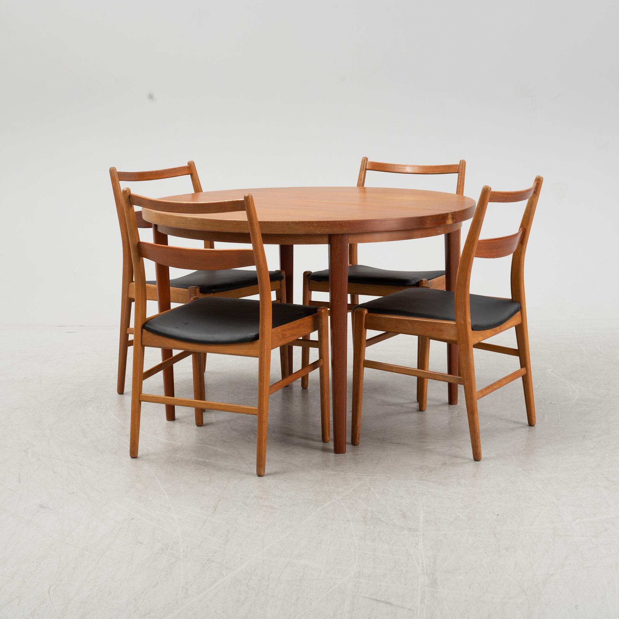 A five-piece teak and oak dining suite, second half of the 20th Century.