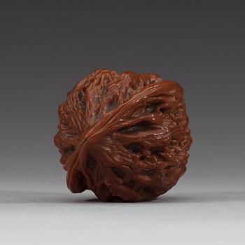 Two pairs of carved walnut hand exercisers, late Qing dynasty (1644-1912).