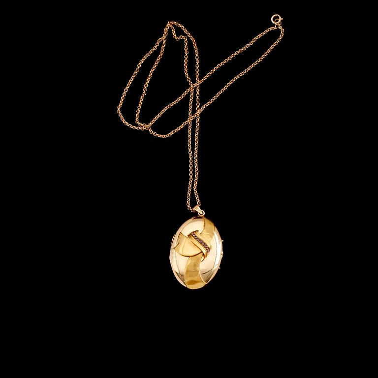 MEDALJONG MED KEDJA, 18 k guld, svenska stämplar  1917. Total vikt ca 18 g.