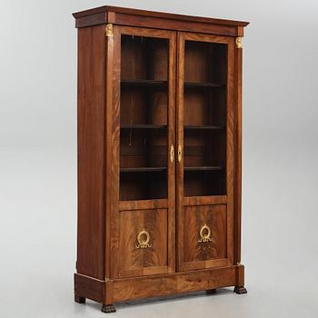 A French Empire mahogany and gilt-bronze mounted bibliothèque, early 19th century.