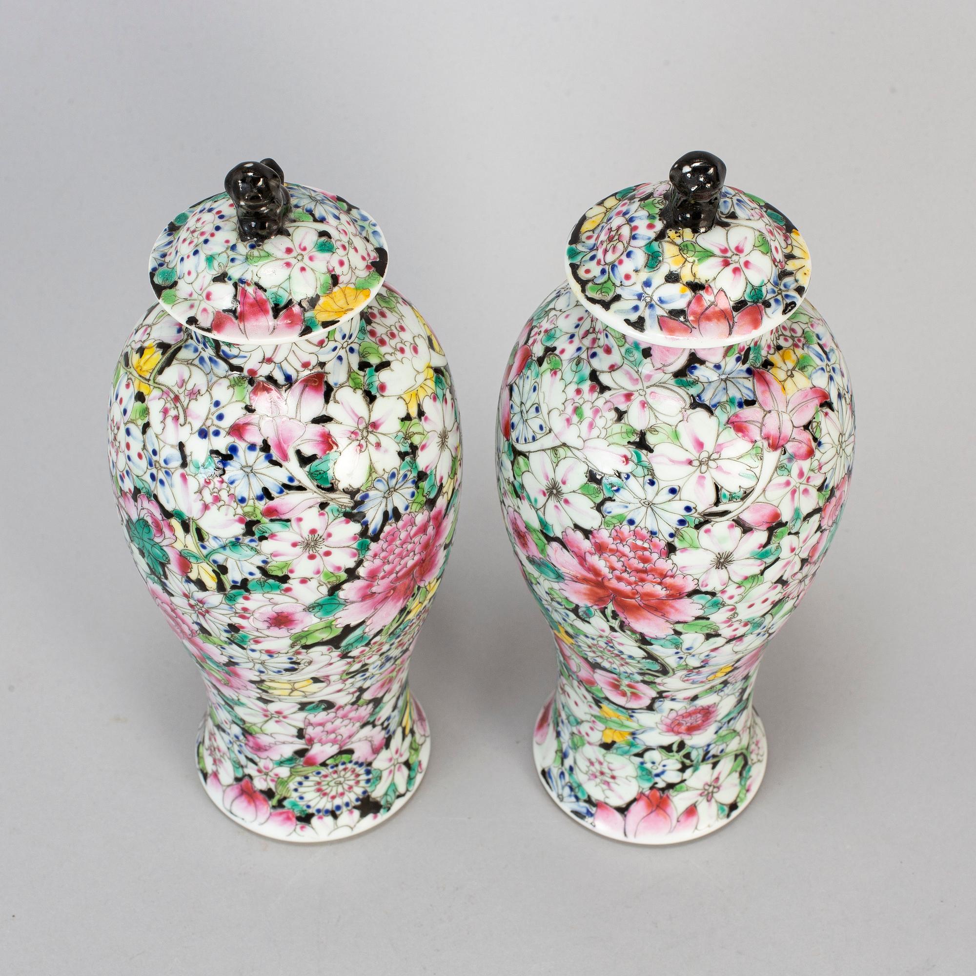 A pair of Chinese 'Mille fleur' porcelain vases with covers, 20th century.