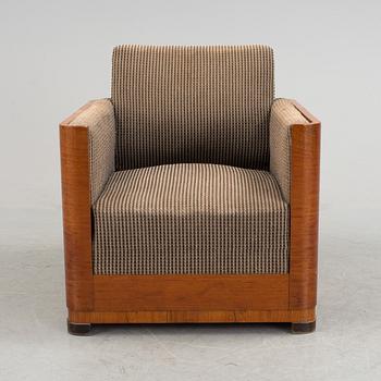 An Art Deco armchair veneered with walnut from the 1930's.