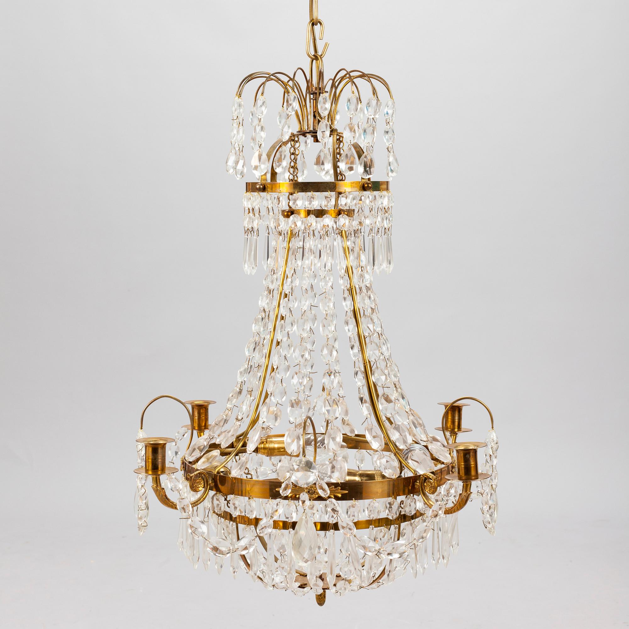 A Gustavian style chandelier from the first half of the 20th century. Height 67 cm.
