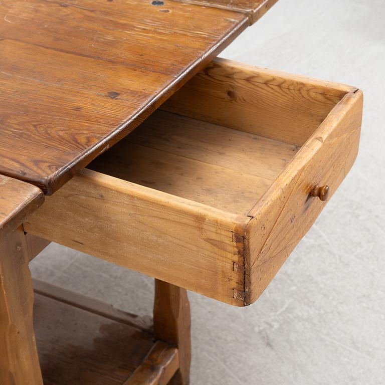 An 19th century drop-leaf table.