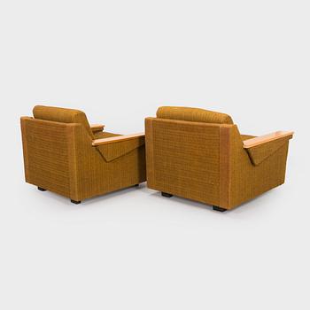 A pair of 1970s armchairs.