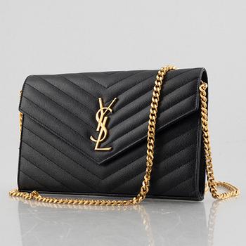 Yves Saint Laurent, a handbag/clutch.