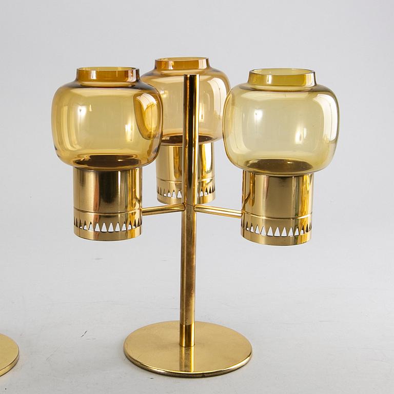 HANS-AGNE JAKOBSSON, a set of two brass candle sticks and extra glass.