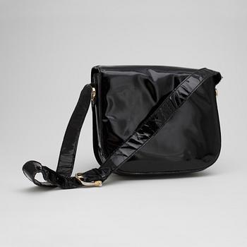 CÉLINE, a black patent leather shoulder bag.