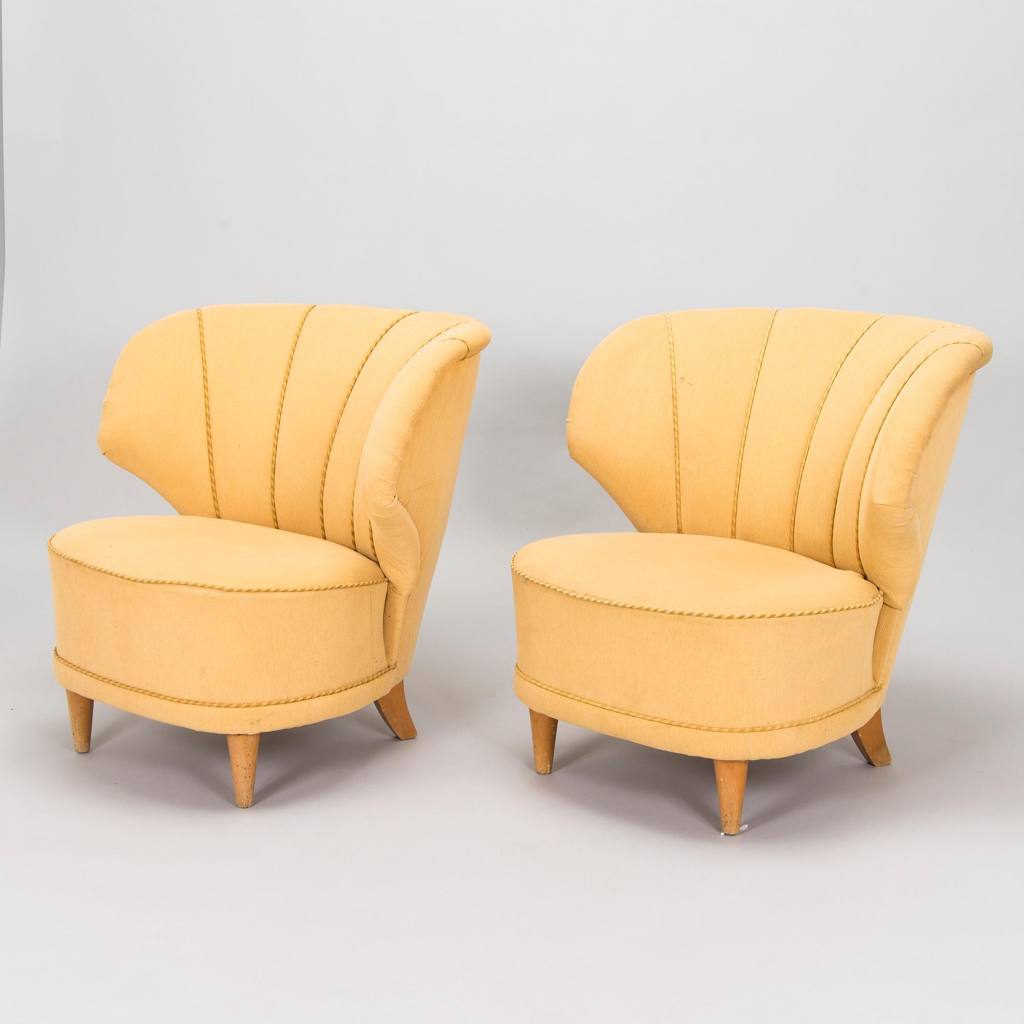 A pair of mid-20th century armchairs.