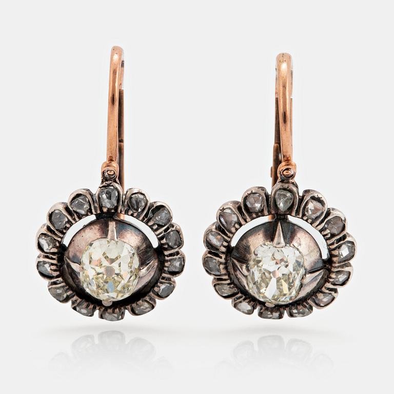 A pair of 9K gold and silver earrings set with old- and eight-cut diamonds.