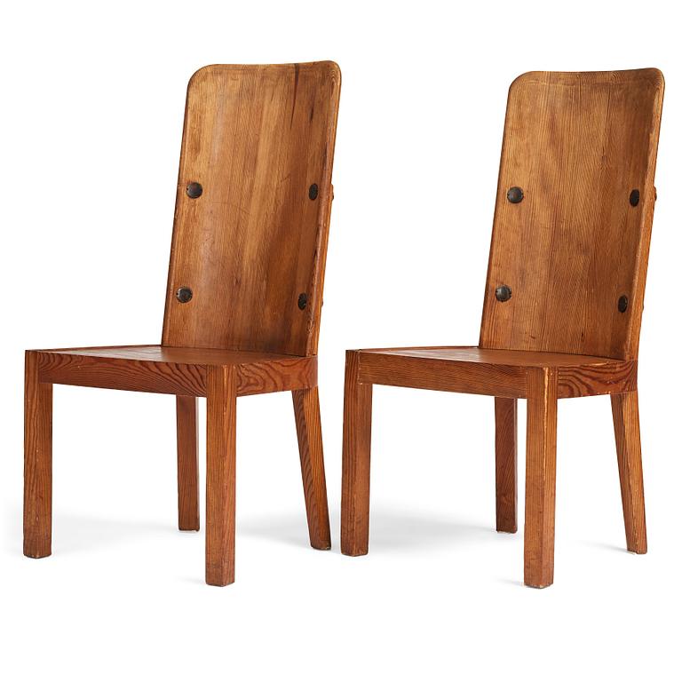 Axel Einar Hjorth, a pair of stained pine "Lovö" chairs, Nordiska Kompaniet, Sweden 1930's.