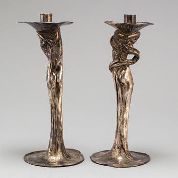 A 20th Century pair of art noveau style candle sticks marked A.W.OX.