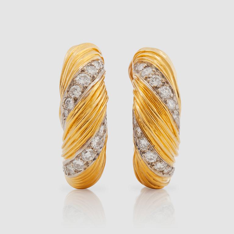 A pair of Kutchinsky brilliant-cut diamond earrings.