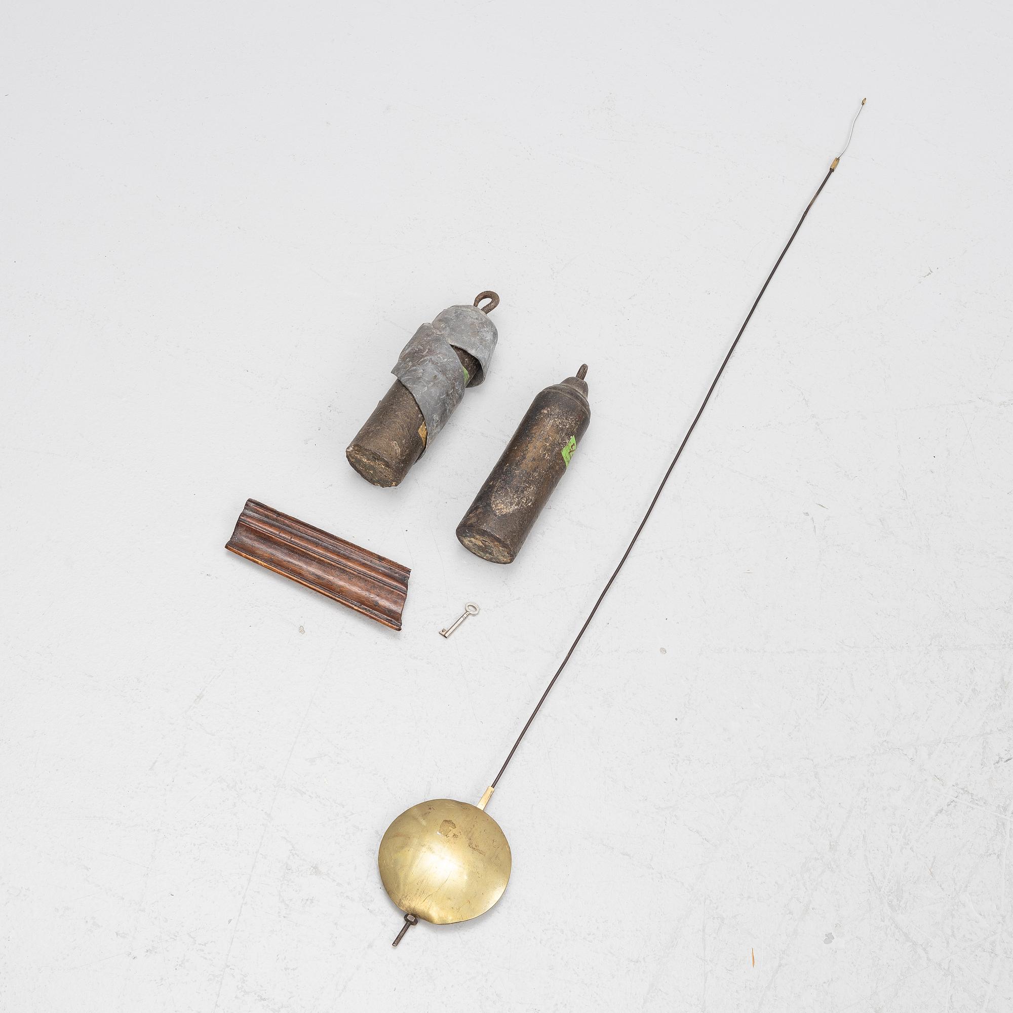 A long-case clock, England, 19th century.