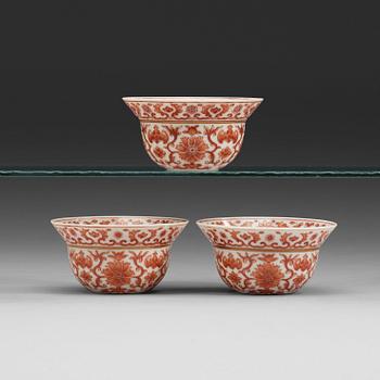 73. A set of three red lotus cups, Qing dynasty with Daoguangs sealmark and period (1821-50).