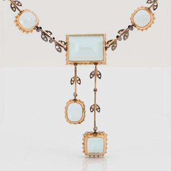 An aquamarine necklace in silver and 14K gold set with rose-cut diamonds.