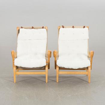 BRUNO MATHSSON, a pair of Pernilla, Dux lounge chair.