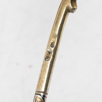 A Russian silver niello napkin ring and spoon, late 19th century-early 20th century.