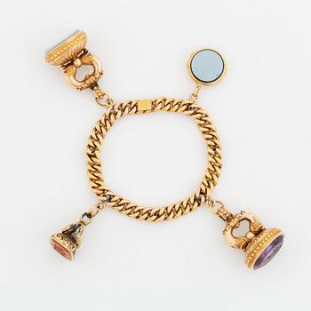 Armband 18K guld med sigillberlocker.
