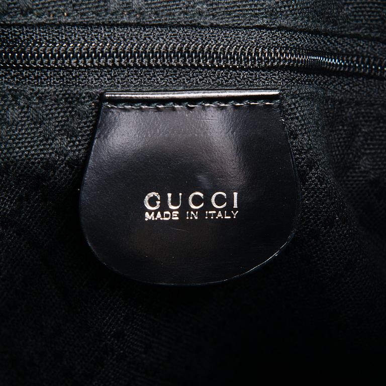 GUCCI, a black nylon handbag.