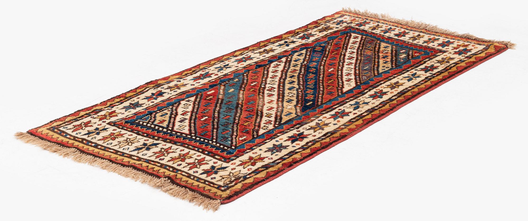 An antique Gendje rug, south Caucasus, c. 208 x 103 cm.