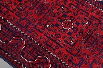 A Afghan runner carpet, 304 x 84 cm.