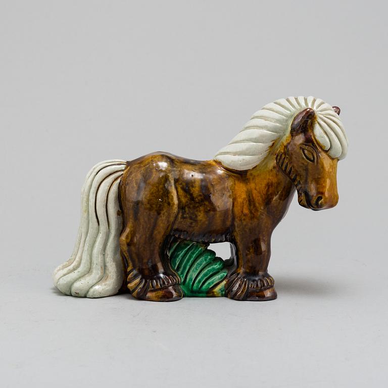 GUNNAR NYLUND, a chamotte stoneware figurine of a horse, from Rörstrand.