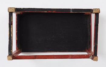 A red lacquer table, around 1900.