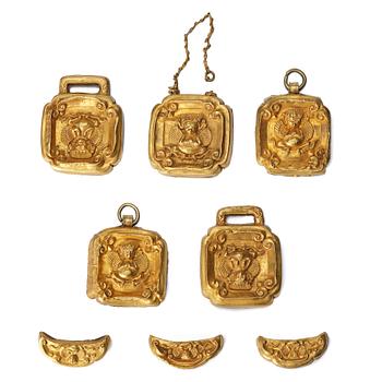 A set of eight gold 'Garuda' belt plaques, Yuan/early Ming dynasty.