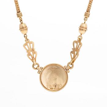Kalevala Koru, an 18K gold 'Sun Lion* necklace, Helsinki 1997, numbered 137/180.