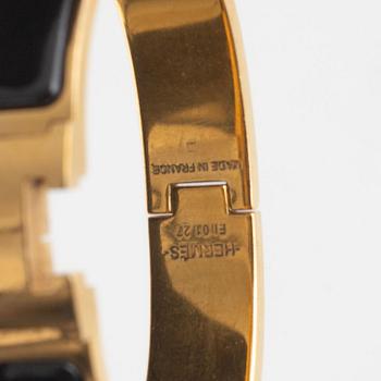 Hermès, a 'Clic H' bracelet.