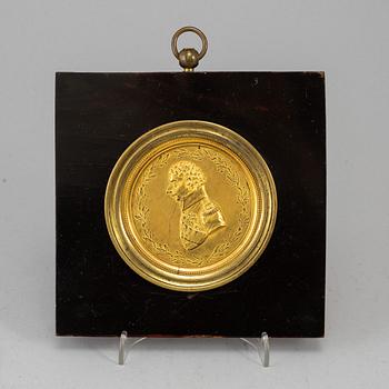 A gilt brass medalion, early 19th century.